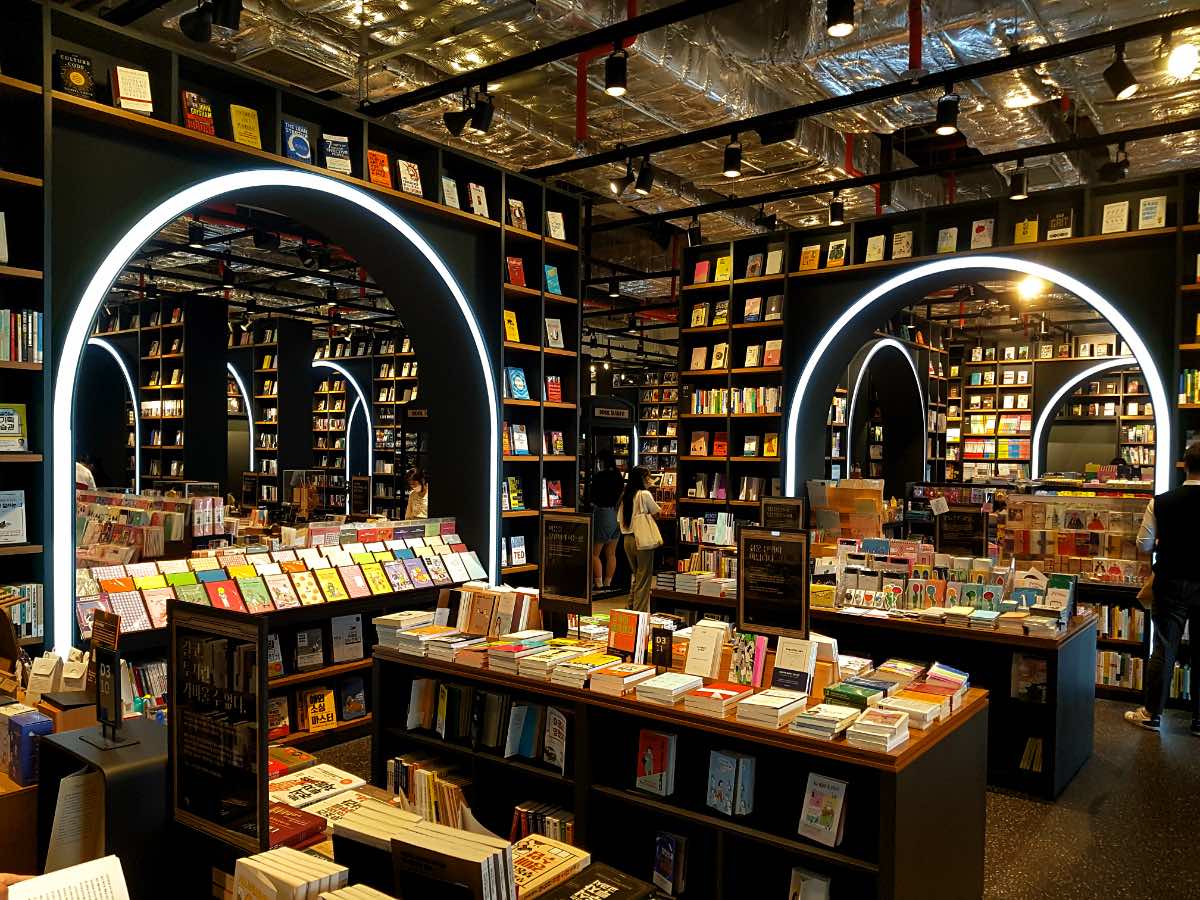 neon arcs in a bookstore