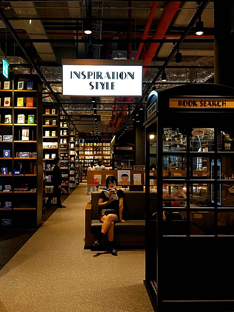 korean woman reading in a bookstore