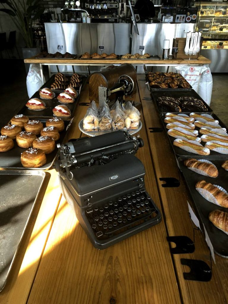 pastries and a typewriter in the middle as a decoration