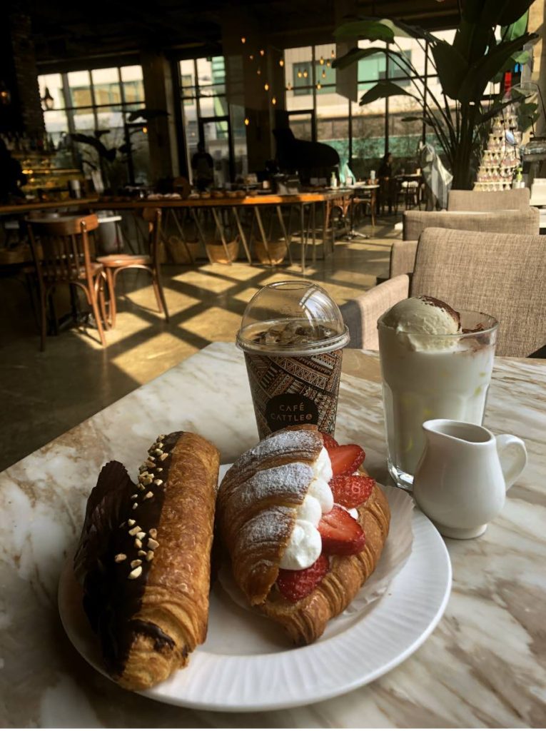 two pastries and two coffees at cafe cattle and bee